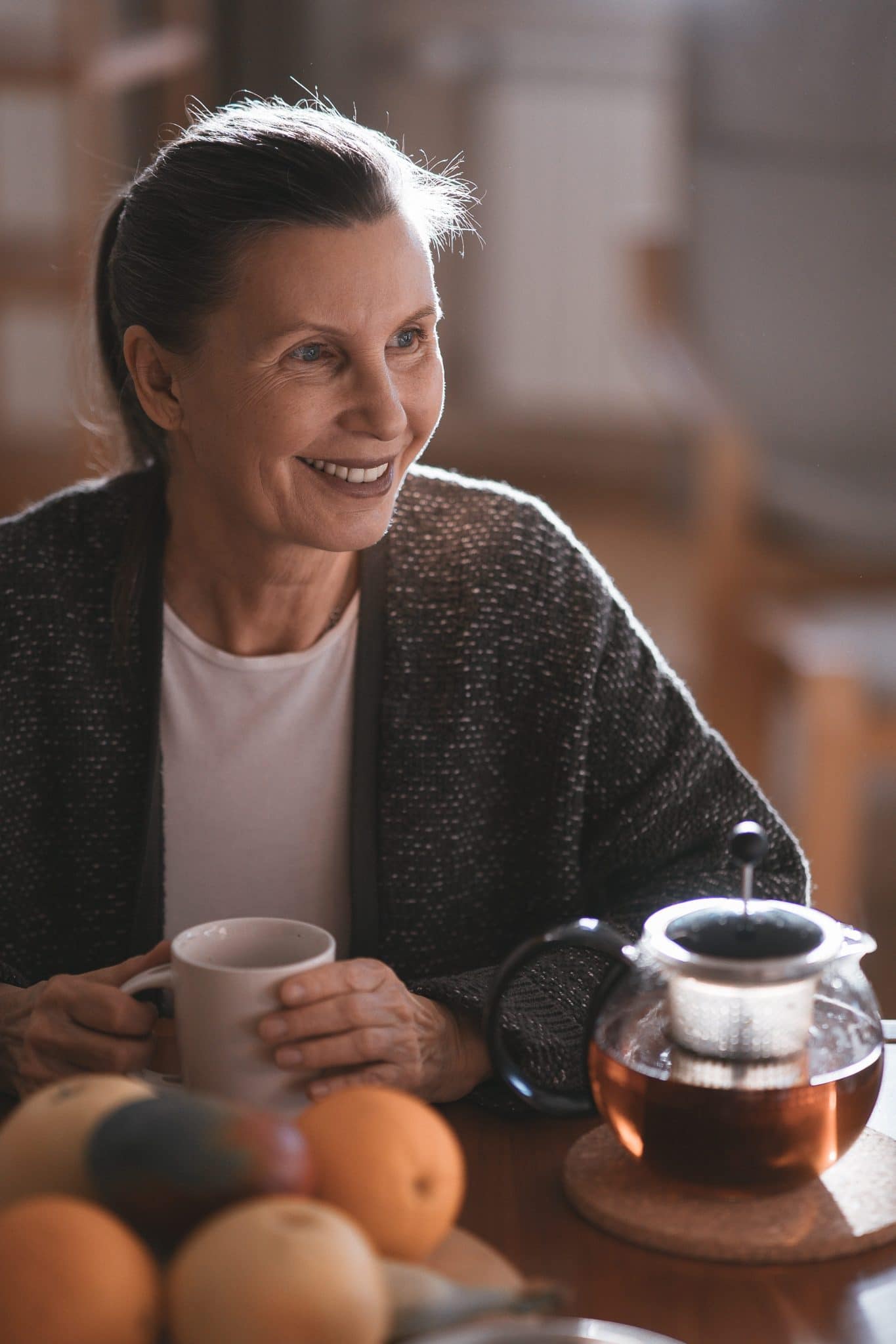 Middle-aged woman enjoying a cup of tea.