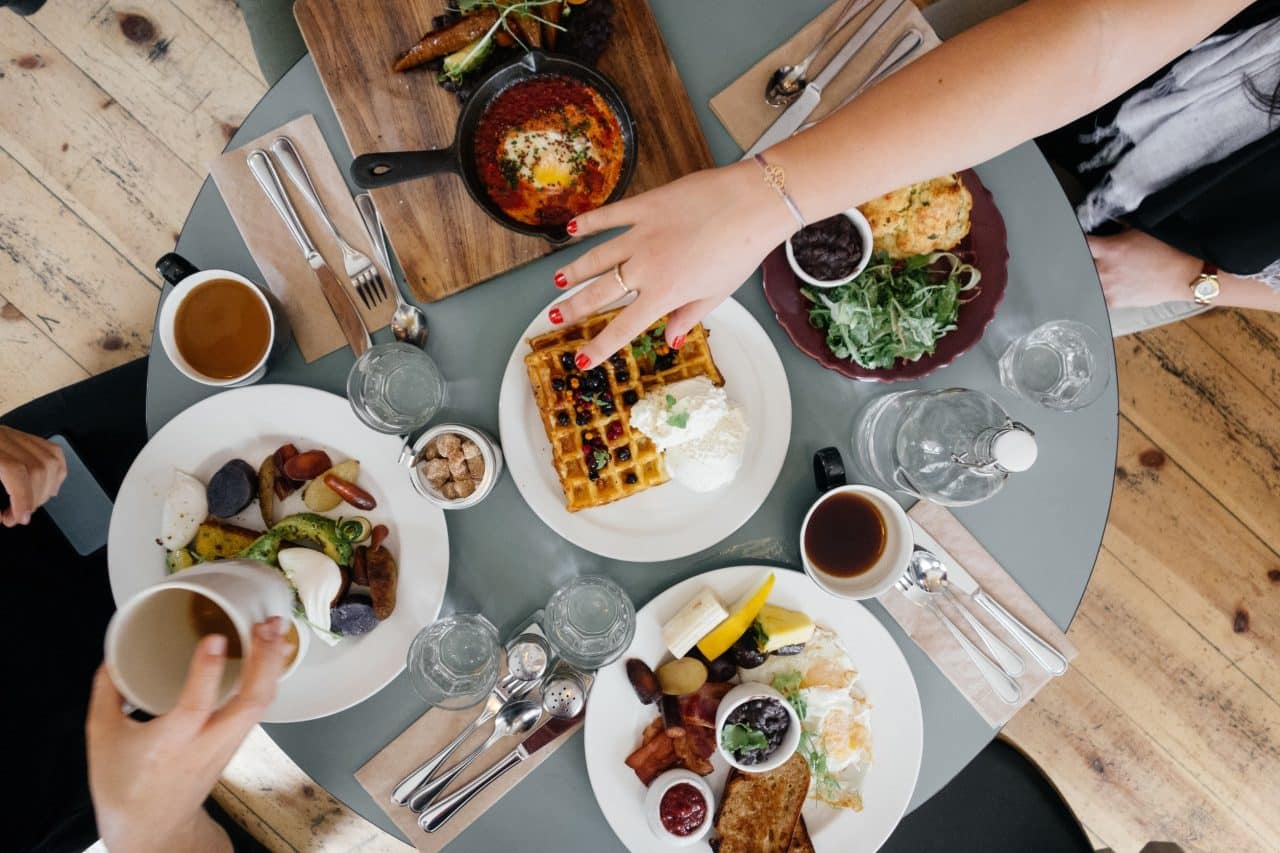 Friends dining out to breakfast.