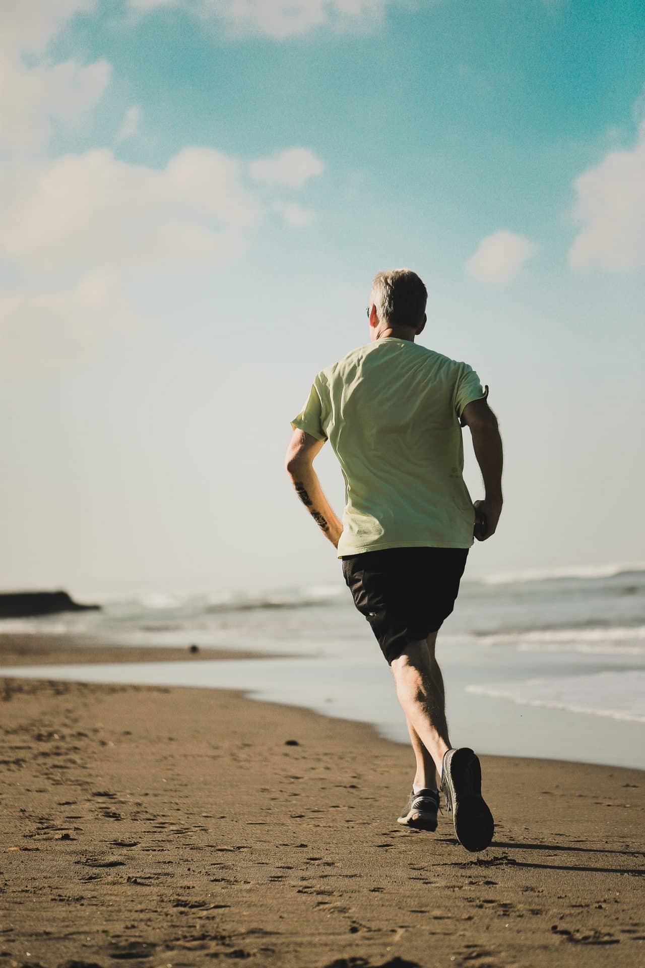 Man running along the beach.