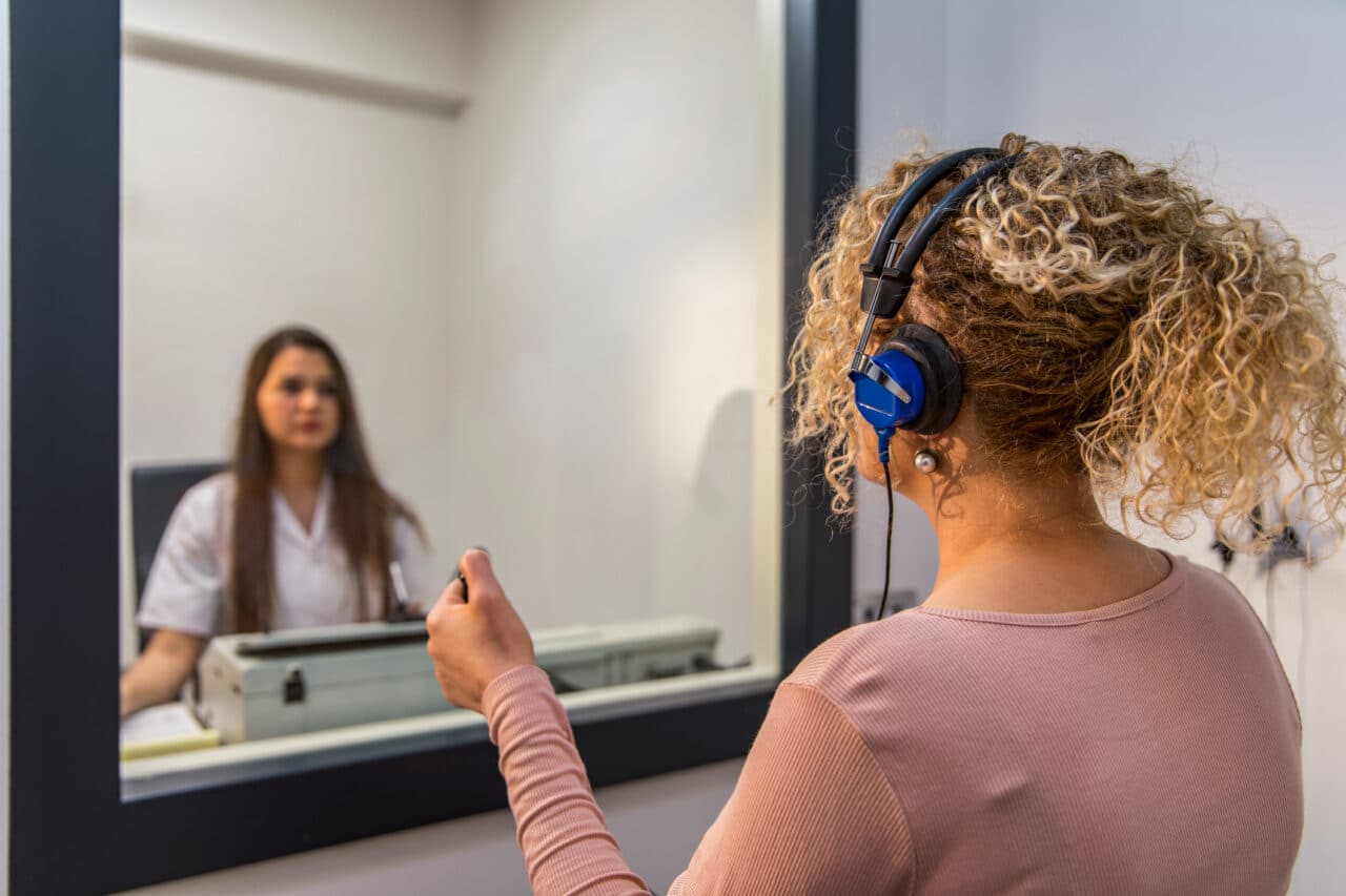 Woman receiving a hearing test.