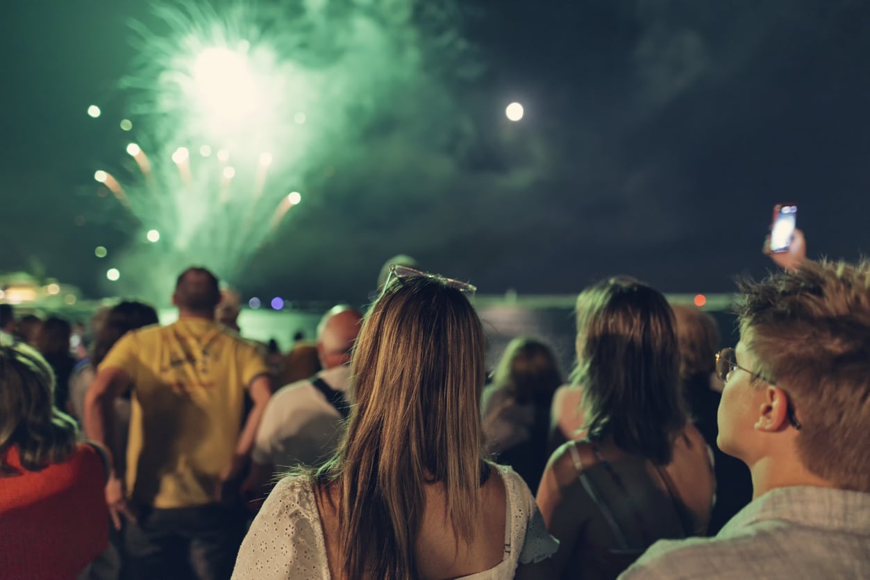 Group of people watching a fireworks display.