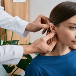 Woman getting her new hearing aid