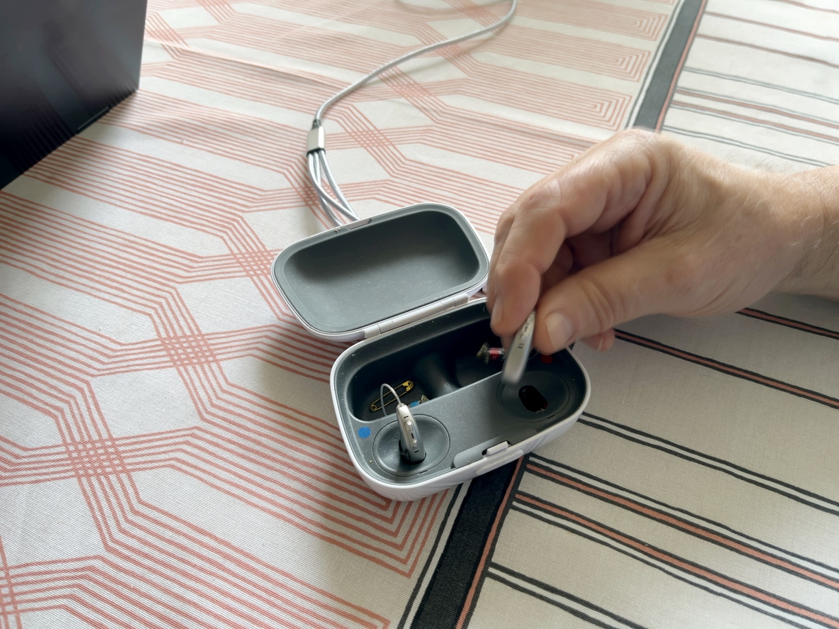 Hearing aids recharging in charging case.