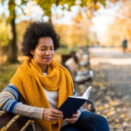Woman reading a book in the public park